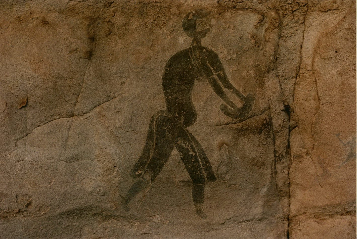 Primitive artwork showing a person in motion.