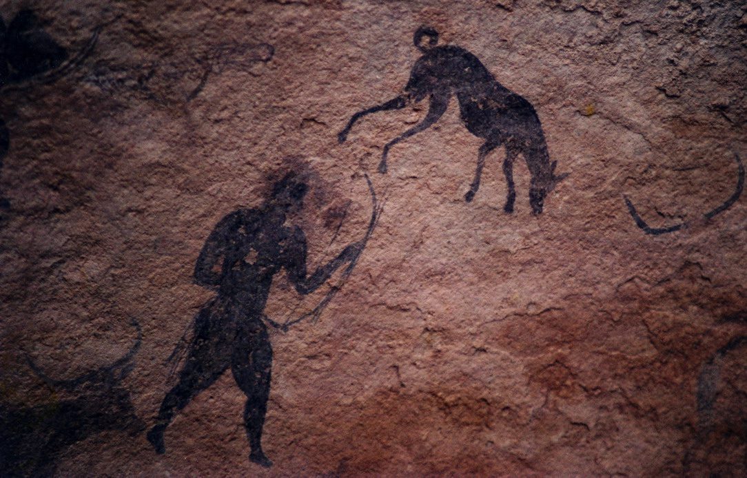 Prehistoric artwork of human and beast