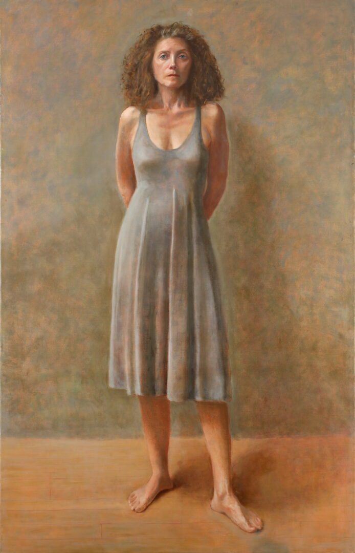 Woman standing in a gray dress